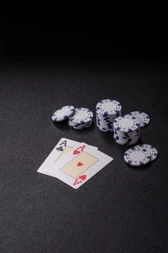 Playing cards and chips on a table, a gambling game of blackjack or baccara.. Photos
