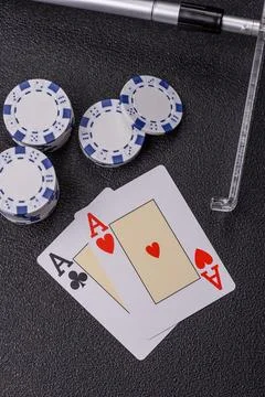 Playing cards and chips on a table, a gambling game of blackjack or baccara.. Photos