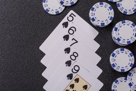 Playing cards and chips on a table, a gambling game of poker. Cards and chips Stock Photos
