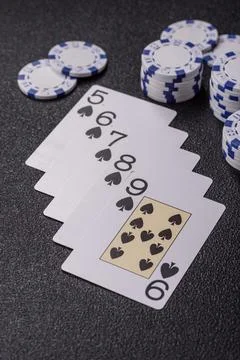Playing cards and chips on a table, a gambling game of poker. Cards and chips Stock Photos