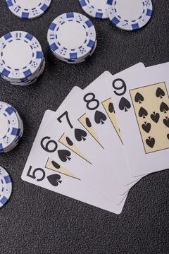 Playing cards and chips on a table, a gambling game of poker. Cards and chips Stock Photos