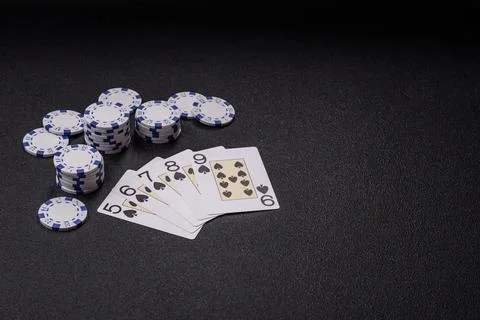 Playing cards and chips on a table, a gambling game of poker. Cards and chips Stock Photos