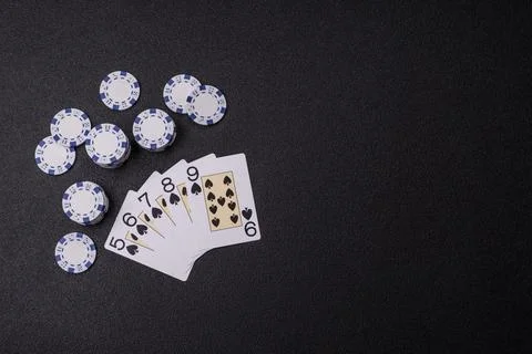 Playing cards and chips on a table, a gambling game of poker. Cards and chips Photos