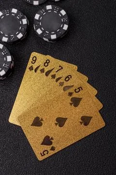 Playing cards and chips on a table, a gambling game of poker. Cards and chips Stock Photos