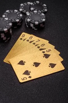 Playing cards and chips on a table, a gambling game of poker. Cards and chips Photos
