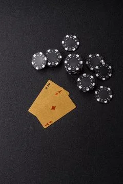 Playing cards and chips on a table, a gambling game of blackjack or baccara.. Photos