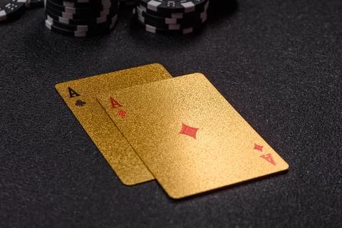 Playing cards and chips on a table, a gambling game of blackjack or baccara.. Photos