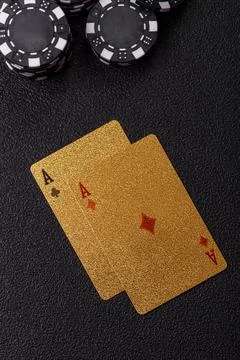 Playing cards and chips on a table, a gambling game of blackjack or baccara.. Photos