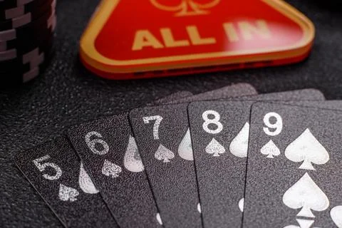 Playing cards and chips on a table, a gambling game of poker. Cards and chips Stock Photos