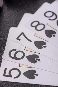 Playing cards and chips on a table, a gambling game of poker. Cards and chips Stock Photos