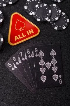 Playing cards and chips on a table, a gambling game of poker. Cards and chips Stock Photos