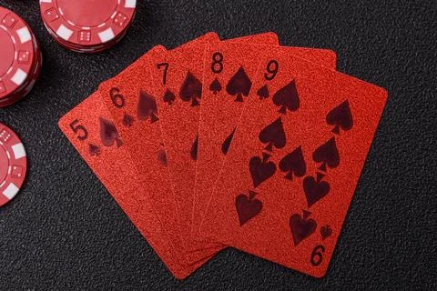 Playing cards and chips on a table, a gambling game of poker. Cards and chips Stock Photos