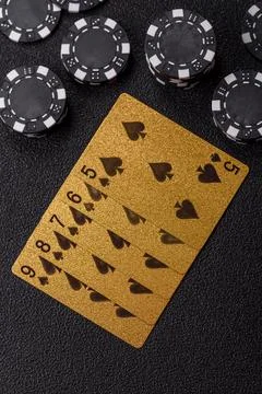 Playing cards and chips on a table, a gambling game of poker. Cards and chips Stock Photos
