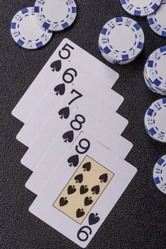 Playing cards and chips on a table, a gambling game of poker. Cards and chips Stock Photos