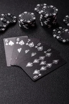 Playing cards and chips on a table, a gambling game of poker. Cards and chips Stock Photos