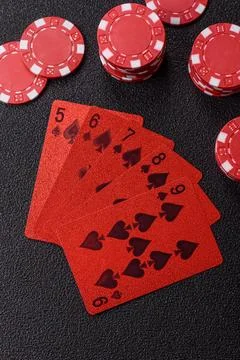 Playing cards and chips on a table, a gambling game of poker. Cards and chips Stock Photos