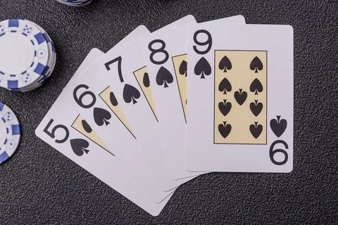 Playing cards and chips on a table, a gambling game of poker. Cards and chips Stock Photos