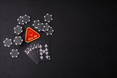 Playing cards and chips on a table, a gambling game of poker. Cards and chips Stock Photos