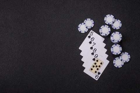 Playing cards and chips on a table, a gambling game of poker. Cards and chips Stock Photos