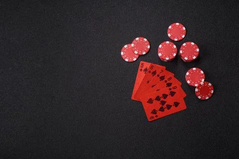 Playing cards and chips on a table, a gambling game of poker. Cards and chips Stock Photos