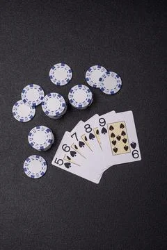 Playing cards and chips on a table, a gambling game of poker. Cards and chips Stock Photos