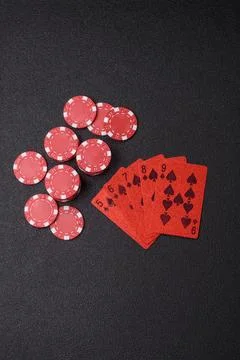 Playing cards and chips on a table, a gambling game of poker. Cards and chips Stock Photos
