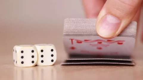 Playing cards and dice on the table Stock Footage 93336620
