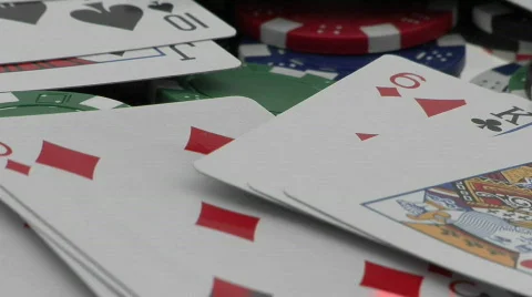 Playing cards and poker chips scattered over a card table. Stock Footage