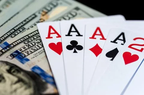 Playing Cards and Stack of 100 American Dollars Bills. Stock Photos