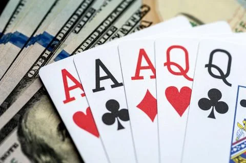 Playing Cards and Stack of 100 American Dollars Bills. Stock Photos