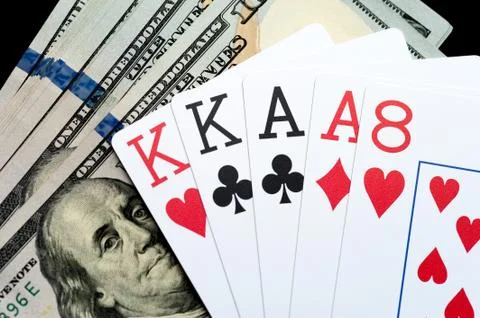 Playing Cards and Stack of American Dollars Bills. Stock Photos