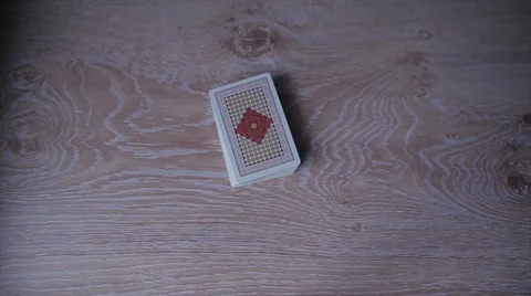 Playing cards are shuffled and handed out three players Stock Footage 59775954