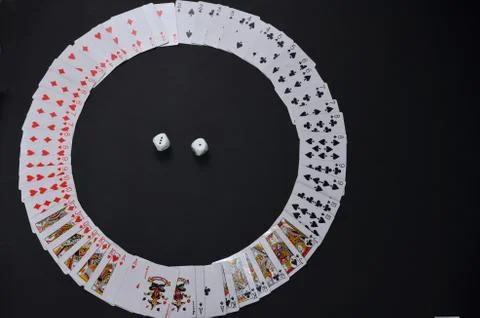 Playing cards on a black background.	 Stock Photos