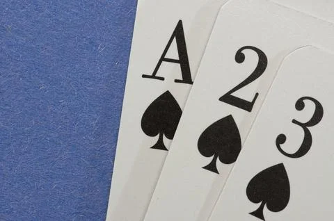 Playing cards on a blue background Stock Photos