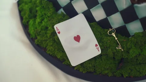 Playing cards as a cake on background of grass. Stock Footage 196180419