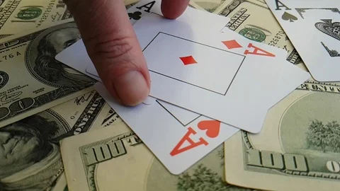 Playing cards, dollars background slow-motion shooting hand Stock Footage 88091569