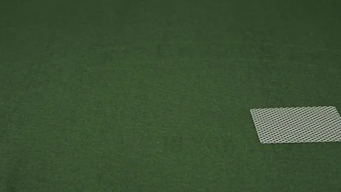 Playing cards falling on green table Видео 70422329