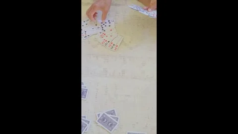 Playing cards in hand during card game on table close up Stock-Footage 331196424
