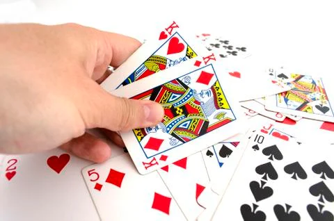 Playing cards in hand Stock Photos