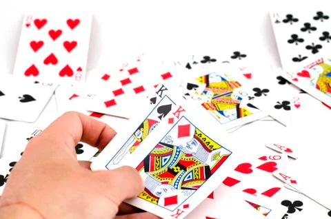 Playing cards in hand Stock Photos