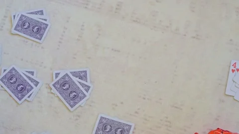 Playing cards scattered on table background with copy space 스톡 동영상 331196387
