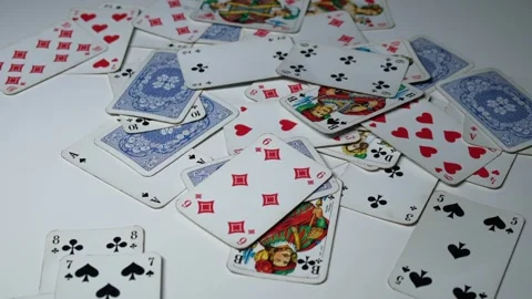 Playing cards scattered on the table Stock Footage 249802044