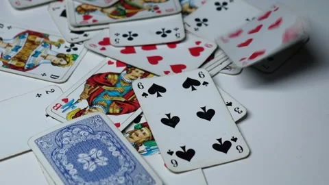 Playing cards scattered on the table Stock Footage 249802202