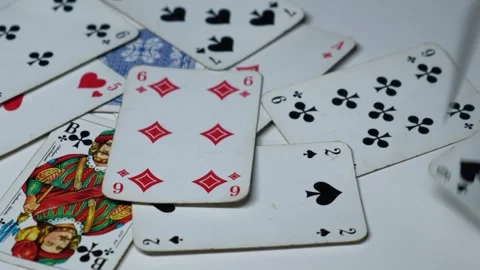 Playing cards scattered on the table Stock Footage 249806122