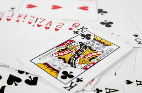 Playing cards spreaded on the white background Stock Photos