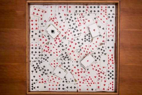 Playing cards on square table Stock Photos