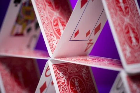Playing cards stacked in a pyramid shape Stock Photos