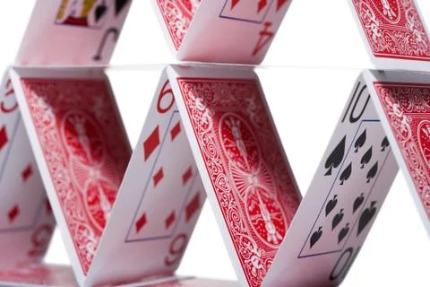 Playing cards stacked in a pyramid shape Stock Photos