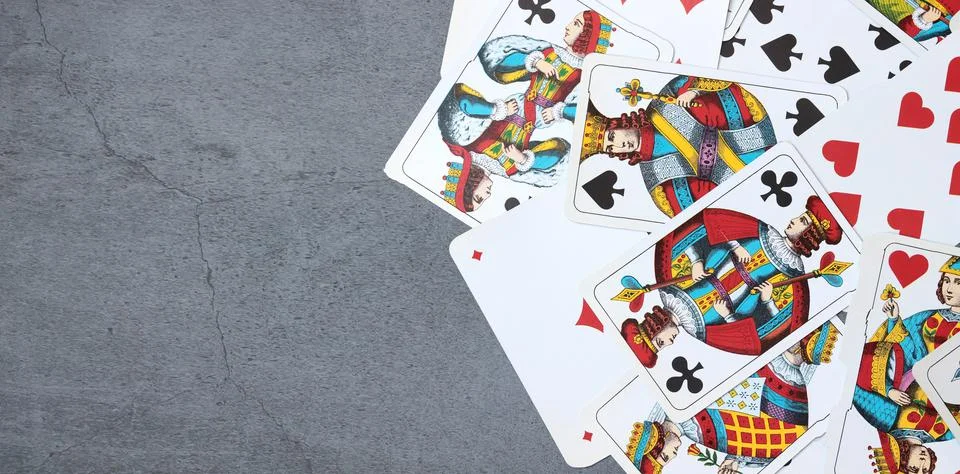 Playing cards on the table, background with copy space Stock Photos