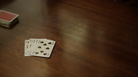 Playing cards at the table, hands with playing cards, close-up Stock Footage 230950359